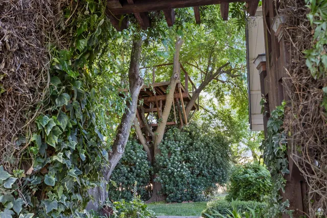 an aerial view of a house with yard