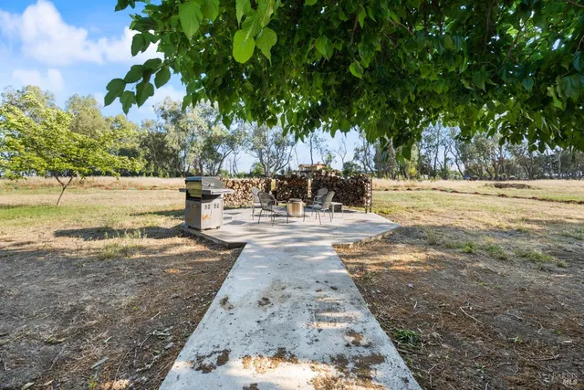 a view of a yard with an outdoor space