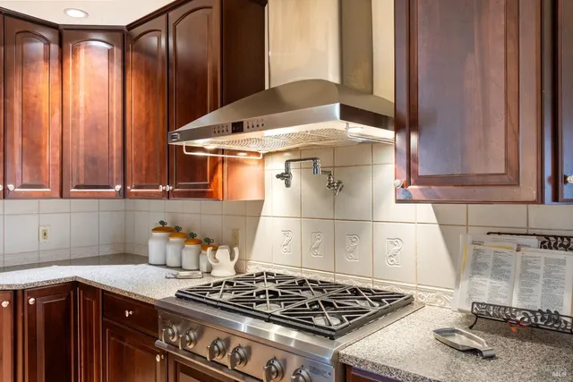 a kitchen with a stove and a sink