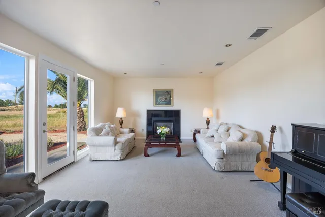 a bed room with furniture and a fireplace