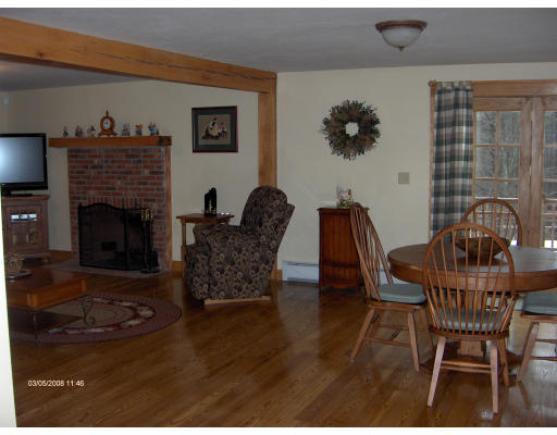 158 Briggs Road West Athol, MA 01331 - Photo 7 of 28 a view of a livingroom with furniture and a fireplace