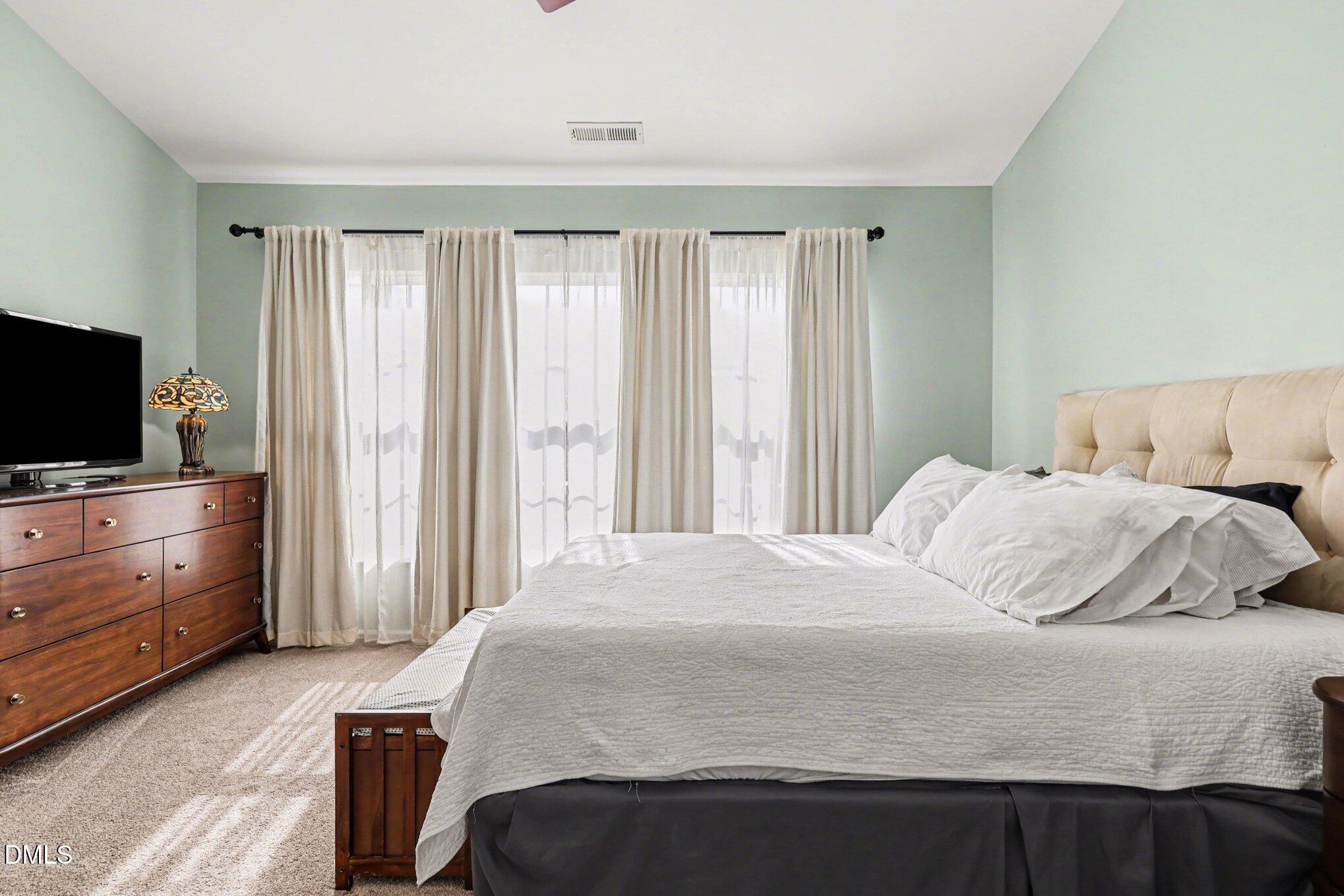 8211 Rhiannon Road Raleigh, NC 27613 - Photo 4 of 25 Primary Bedroom