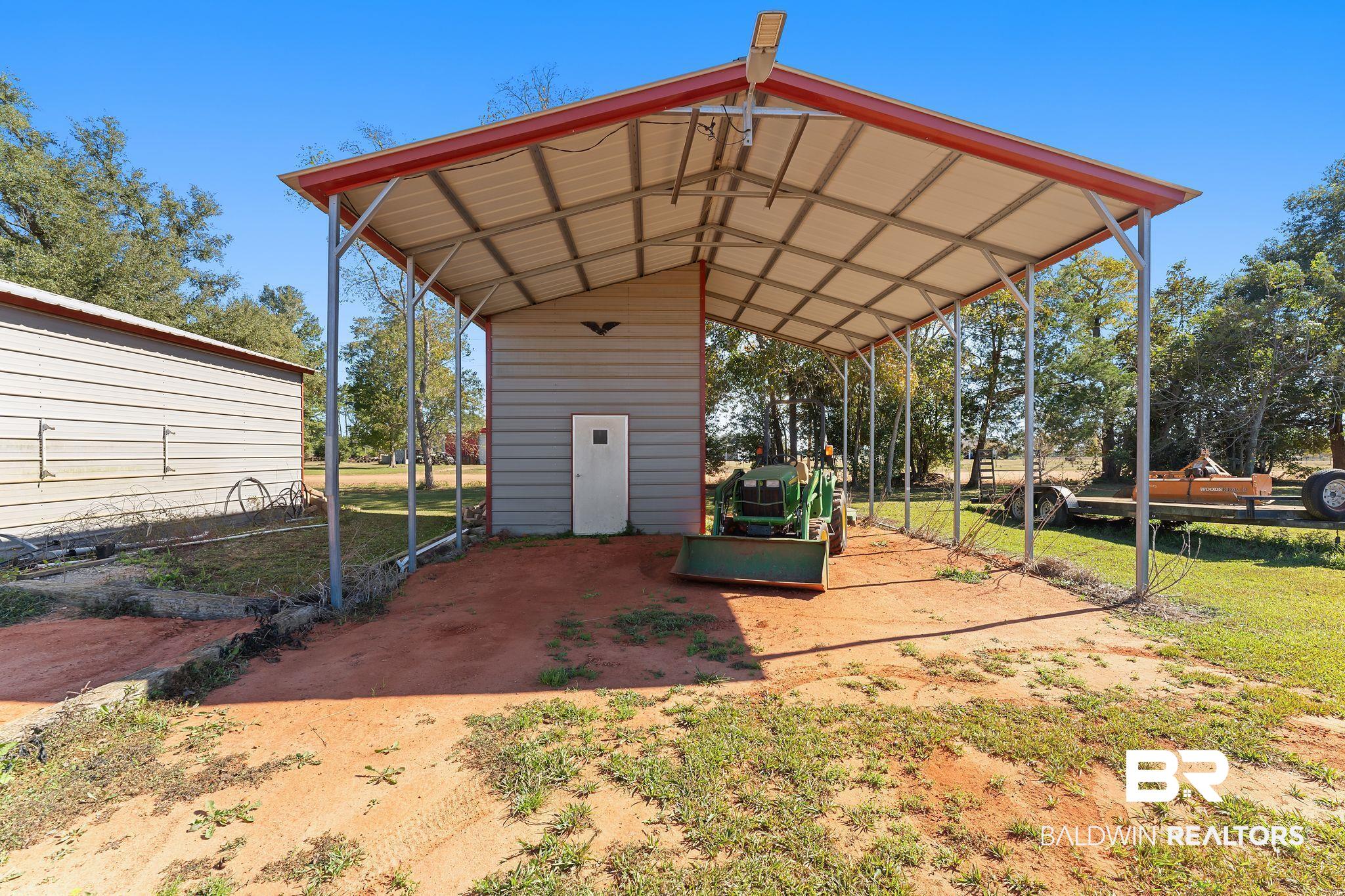 28980 Comstock Road Elberta, AL 36530 - Photo 28 of 38 View of vehicle parking featuring a detached carport