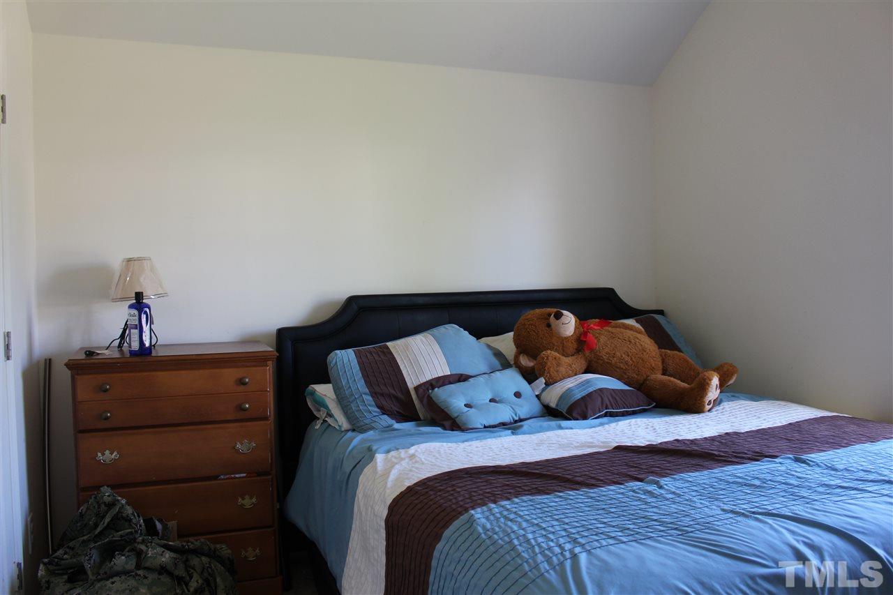 1432 Ricochet Drive Raleigh, NC 27610 - Photo 11 of 23 a bedroom with a bed and with furniture
