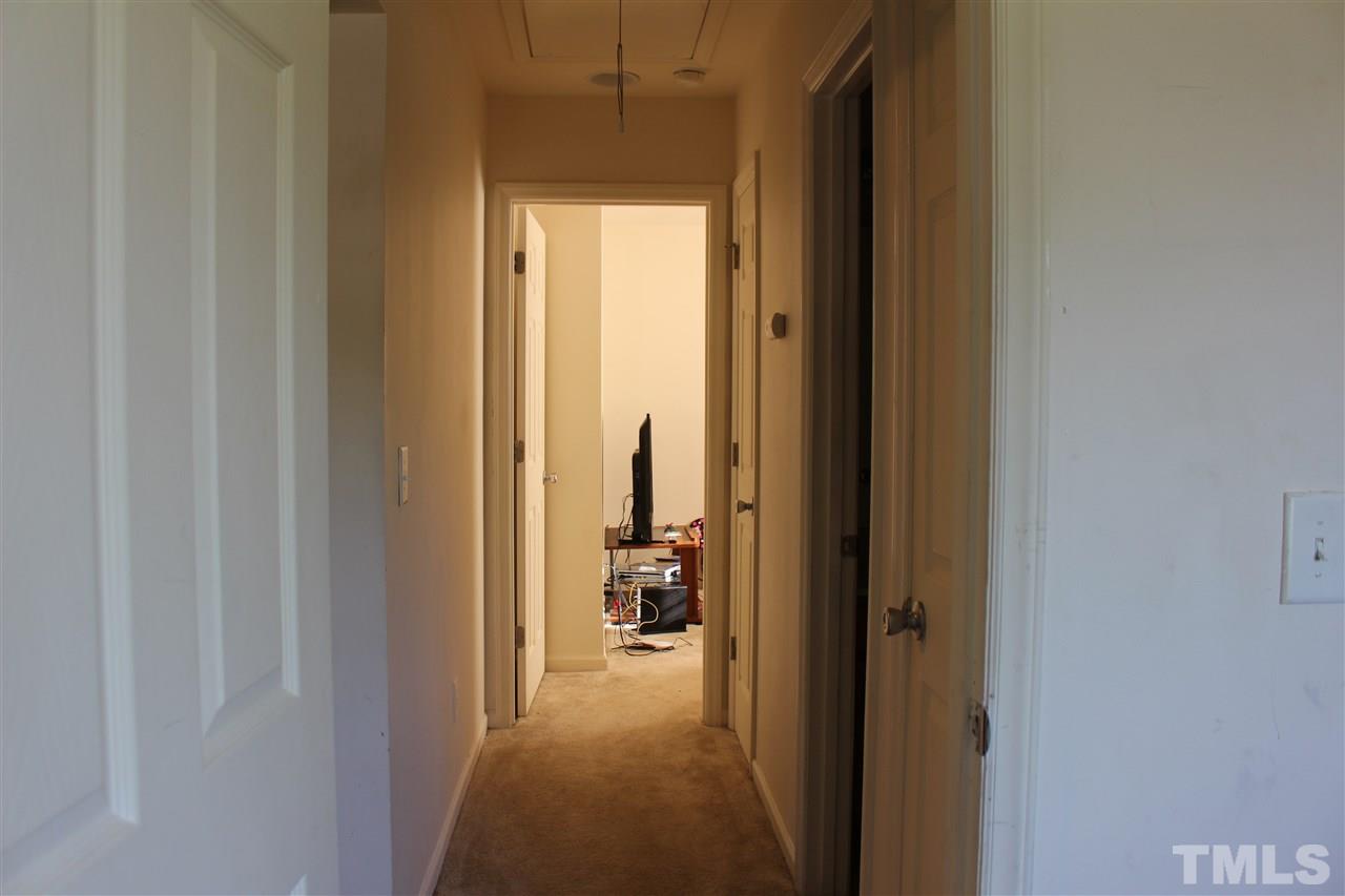 1432 Ricochet Drive Raleigh, NC 27610 - Photo 12 of 23 a view of a bathroom from a hallway