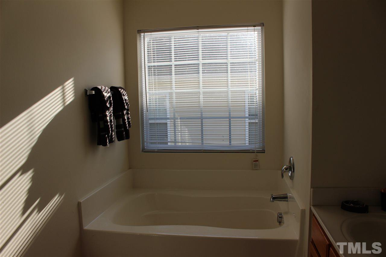 1432 Ricochet Drive Raleigh, NC 27610 - Photo 21 of 23 a bathroom with a bathtub