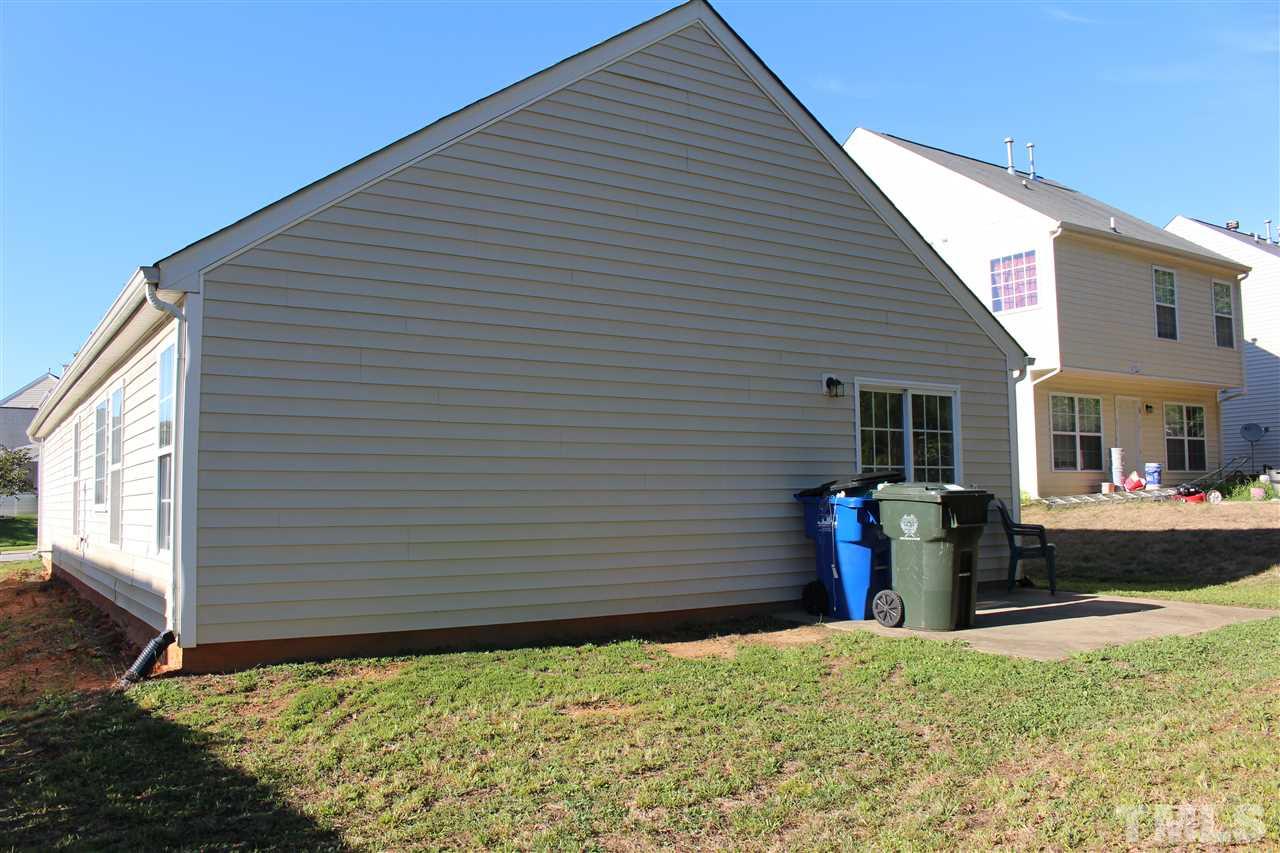 1432 Ricochet Drive Raleigh, NC 27610 - Photo 4 of 23 a backyard of a house