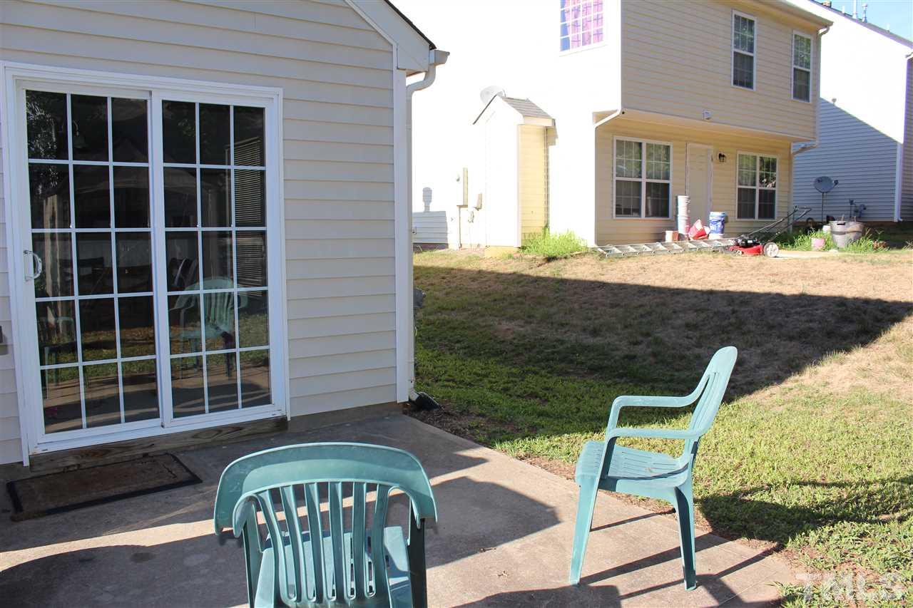 1432 Ricochet Drive Raleigh, NC 27610 - Photo 5 of 23 a view of a chair and table in the balcony