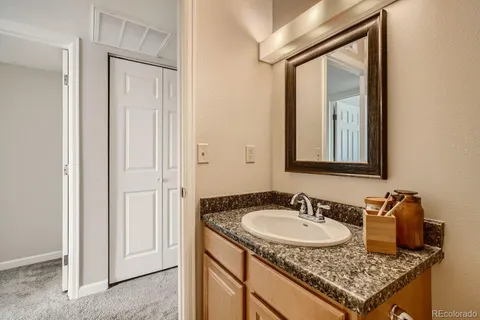 a view of a bedroom with furniture and front door