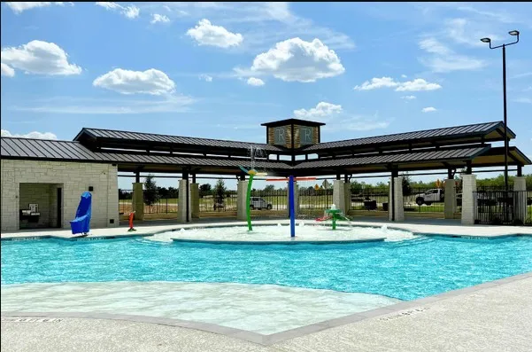 a view of a swimming pool with an outdoor space and seating area