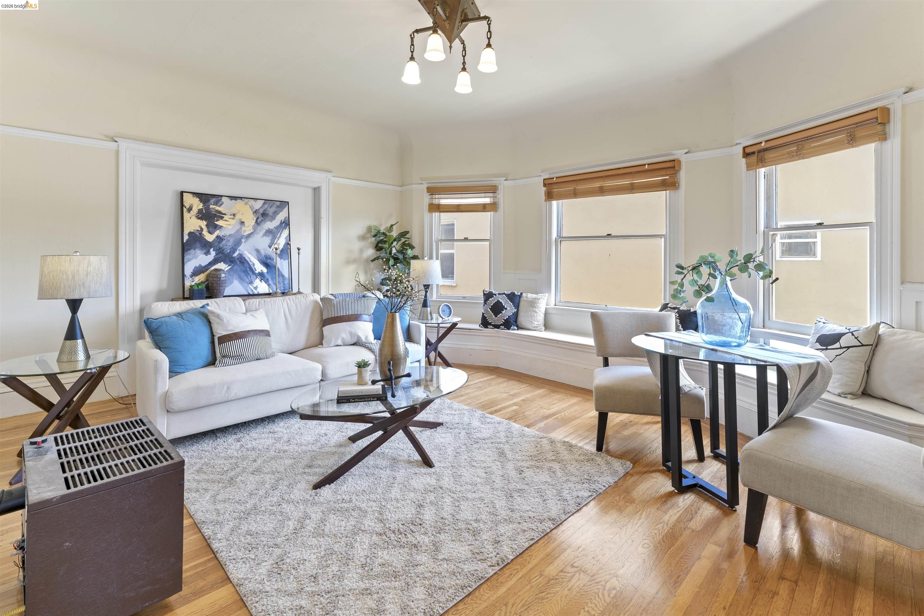 667 10th Street Oakland, CA 94607 - Photo 3 of 15 a living room with furniture and a large window