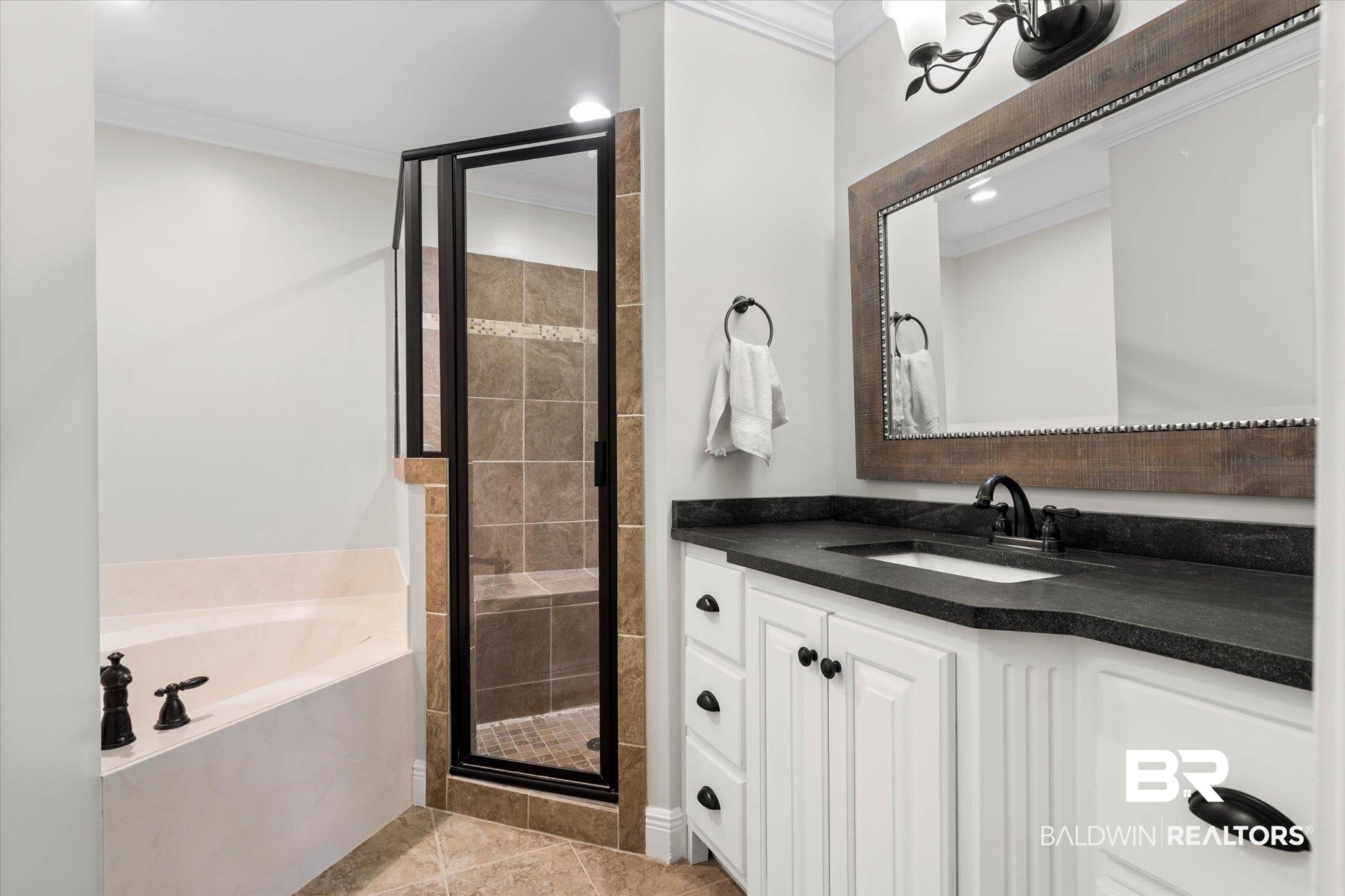 3715 Latigo Road Mobile, AL 36695 - Photo 11 of 39 Bathroom featuring crown molding, a shower stall, a garden tub, vanity, and tile patterned floors