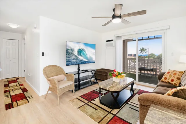 a living room with furniture rug and window