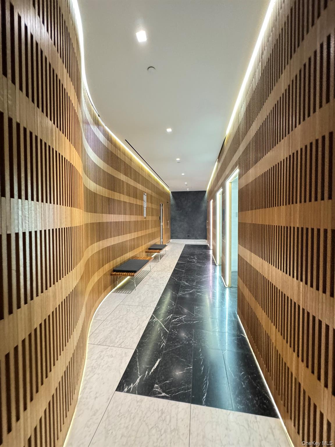 301 West 53rd Street, Unit 9K Manhattan, NY 10019 - Photo 19 of 22 Hall featuring marble tiled floors and recessed lighting