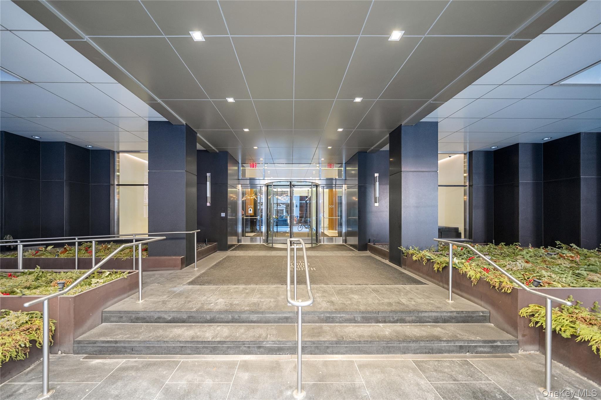 301 West 53rd Street, Unit 9K Manhattan, NY 10019 - Photo 24 of 40 a view of a hall with kitchen and living room