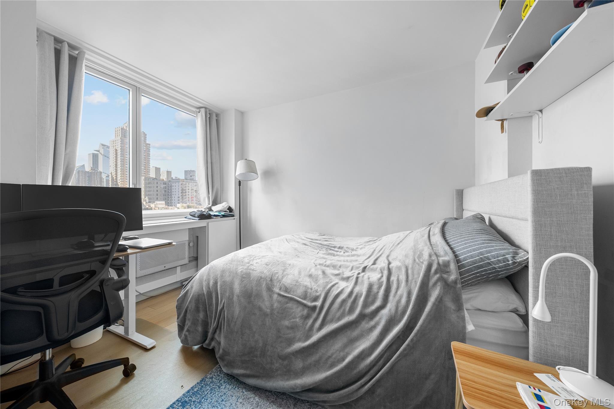 301 West 53rd Street, Unit 9K Manhattan, NY 10019 - Photo 36 of 40 a room with a bed and a television