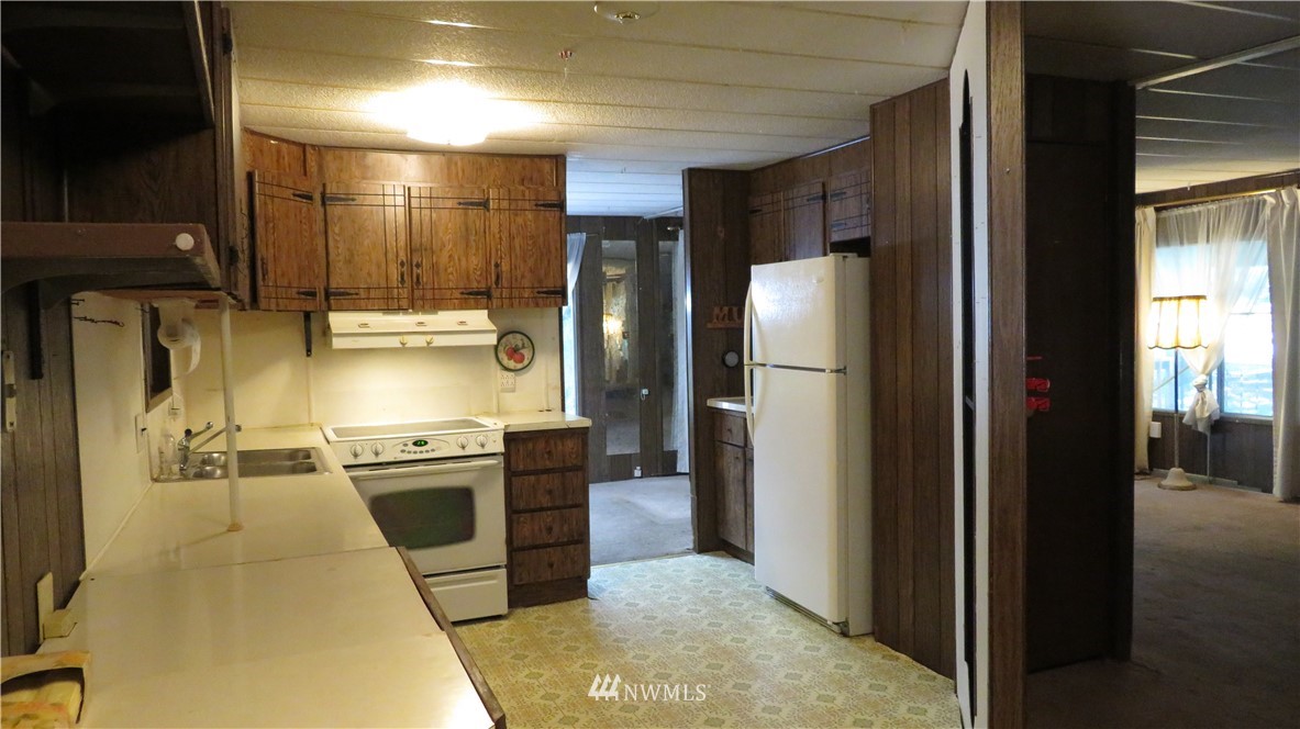 2058 Willeys Lake Road Custer, WA 98240 - Photo 20 of 25 a kitchen with stainless steel appliances granite countertop a refrigerator and a stove