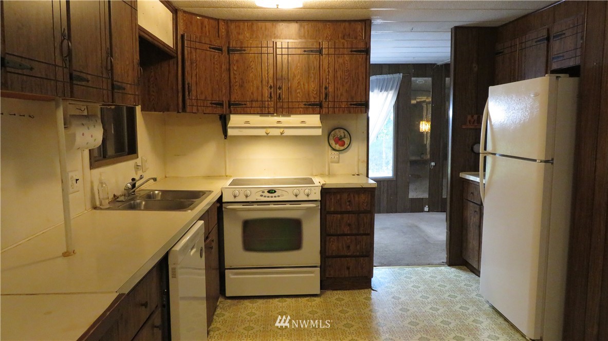2058 Willeys Lake Road Custer, WA 98240 - Photo 21 of 25 a kitchen with a stove and a refrigerator