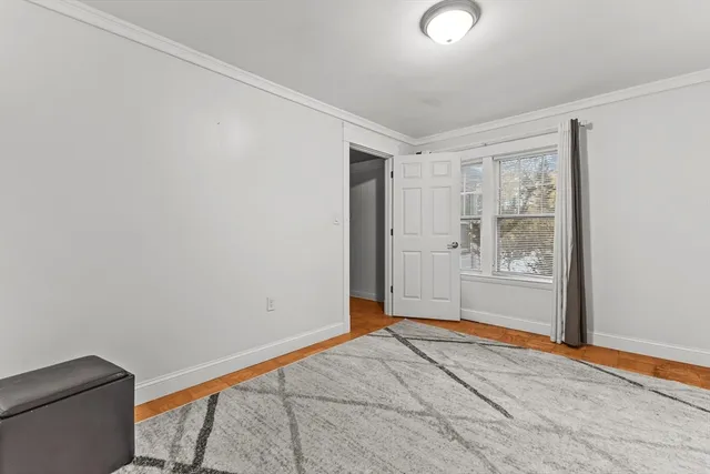 a view of livingroom with furniture wooden floor and windows