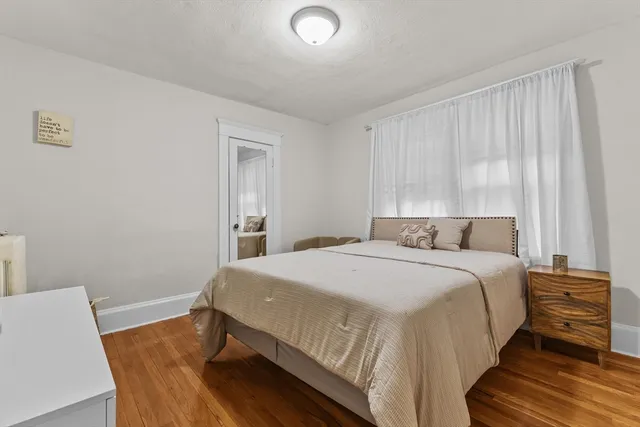 a bedroom with a bed and couch