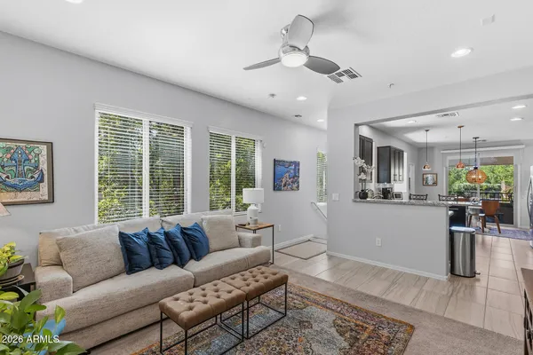 a living room with furniture and a large window