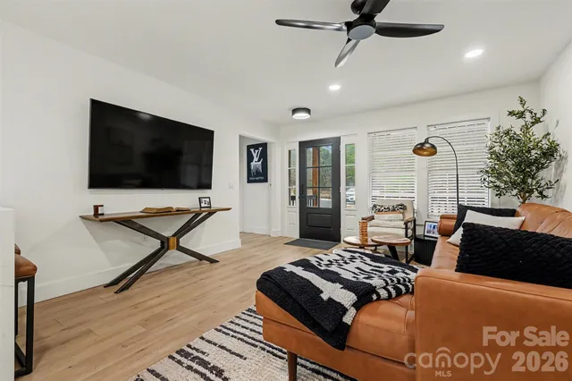 a living room with furniture and a flat screen tv