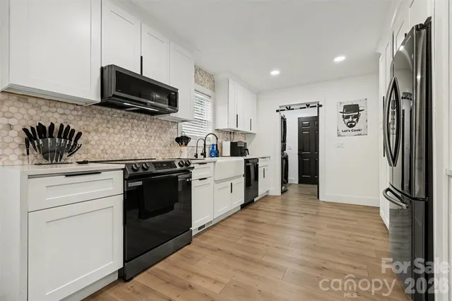 a kitchen with a refrigerator stove and microwave