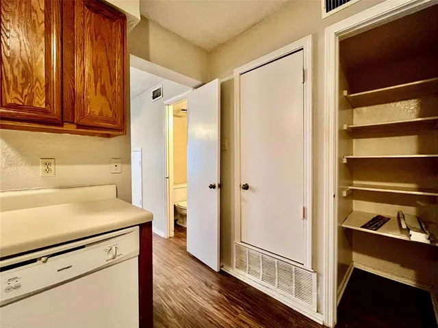 a kitchen with a refrigerator and a sink