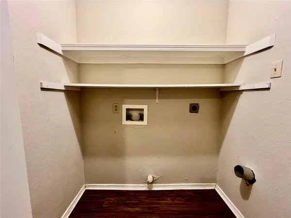 a view of small space with empty racks on the wall