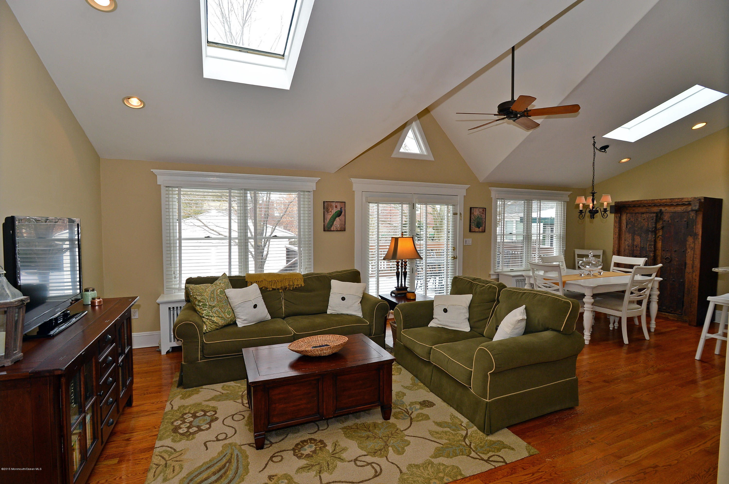 66 Pinckney Road Red Bank, NJ 07701 - Photo 13 of 30 a living room with furniture a ceiling fan and a window