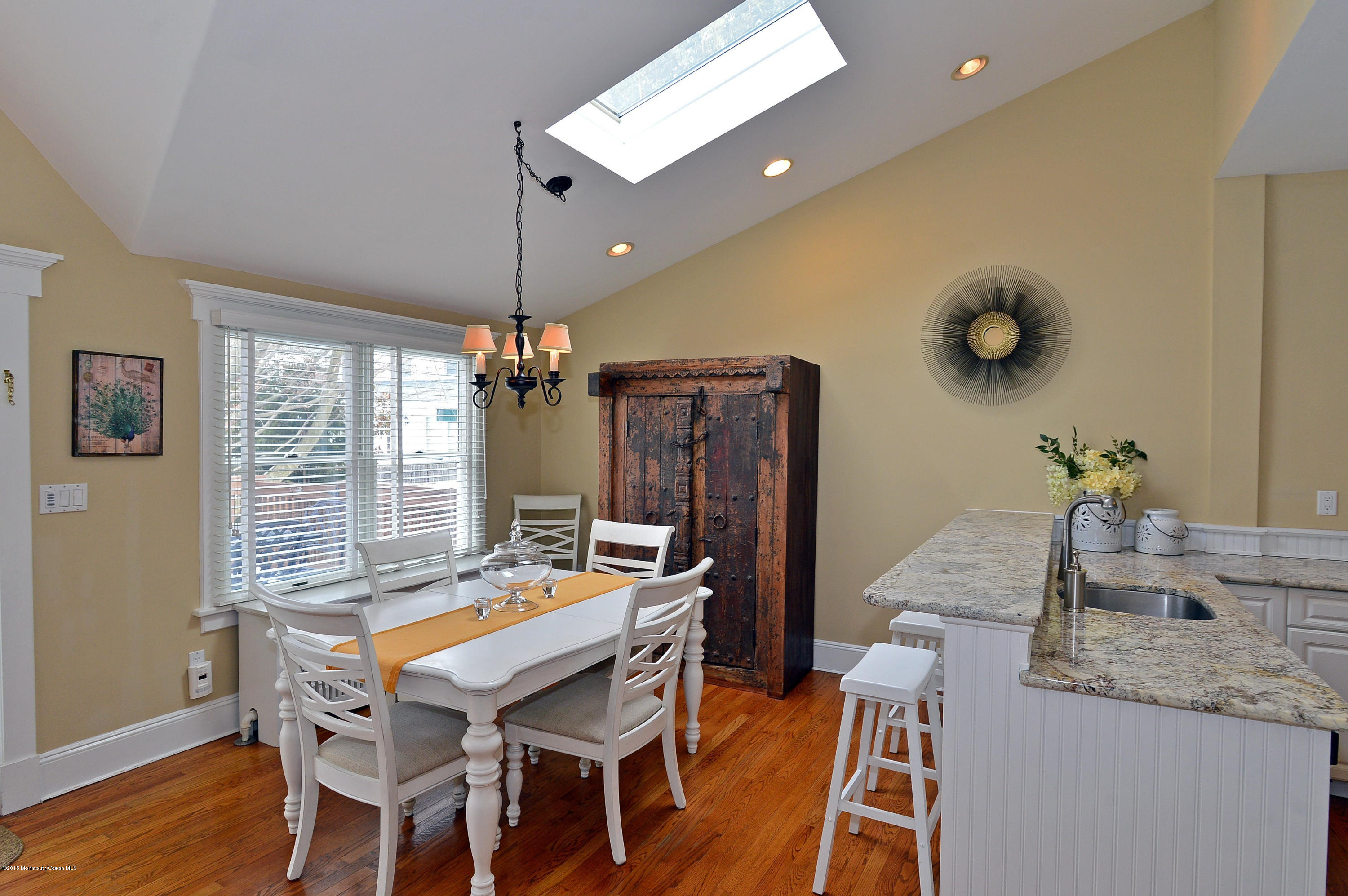 66 Pinckney Road Red Bank, NJ 07701 - Photo 15 of 30 a dining room with furniture a chandelier and window