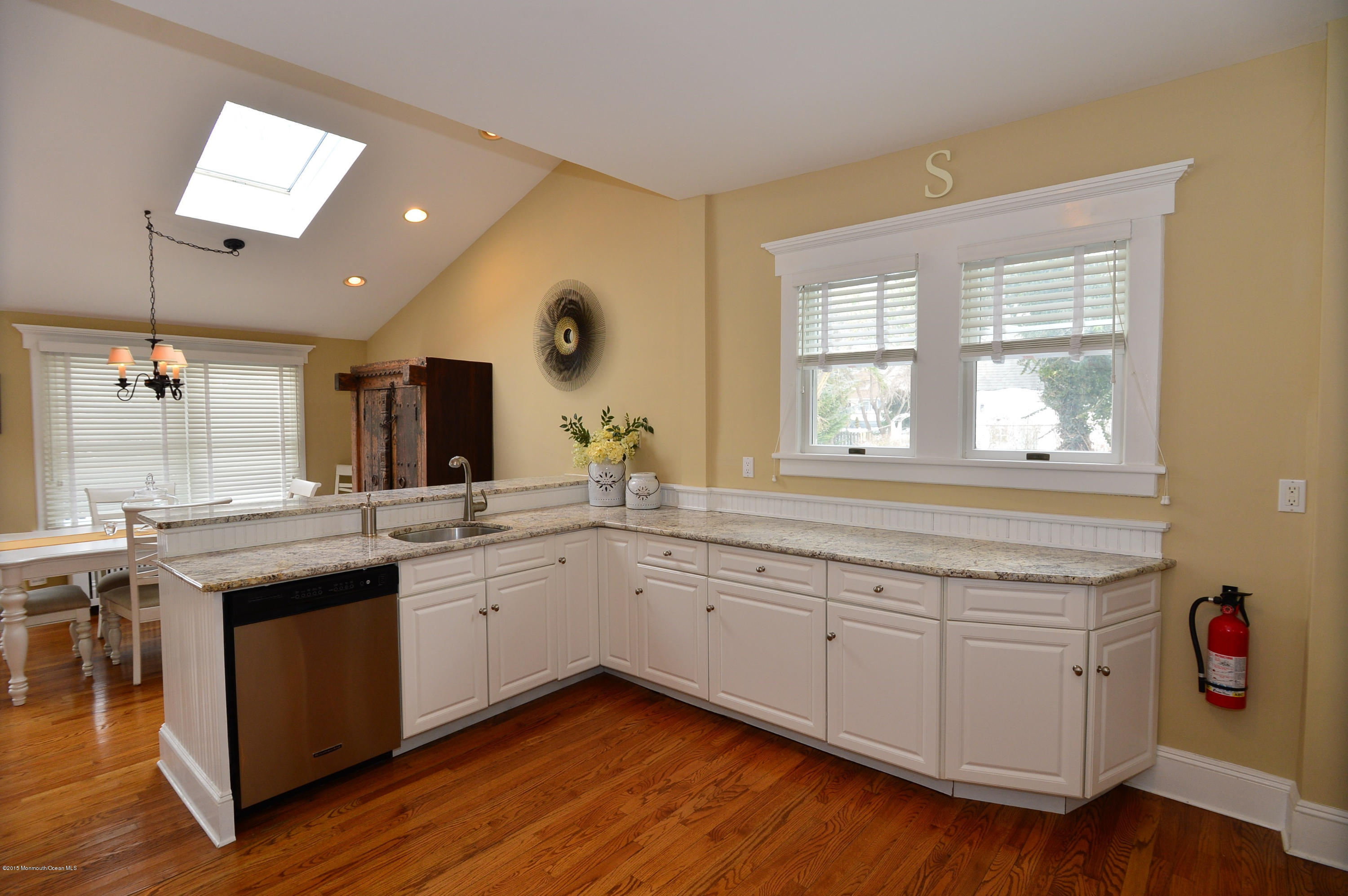 66 Pinckney Road Red Bank, NJ 07701 - Photo 19 of 30 a kitchen with a sink cabinets and wooden floor