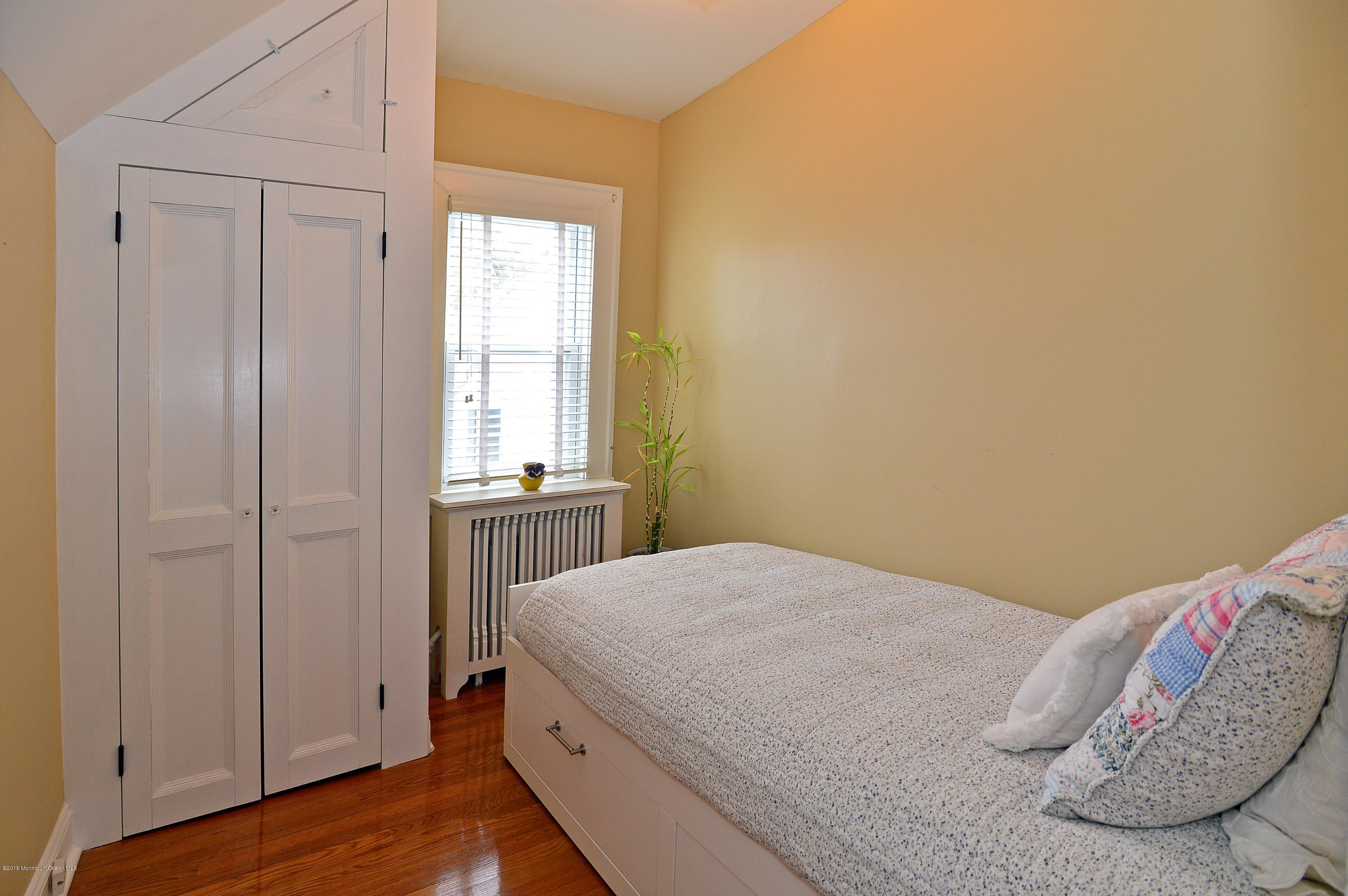 66 Pinckney Road Red Bank, NJ 07701 - Photo 23 of 30 a bedroom with a bed and a window