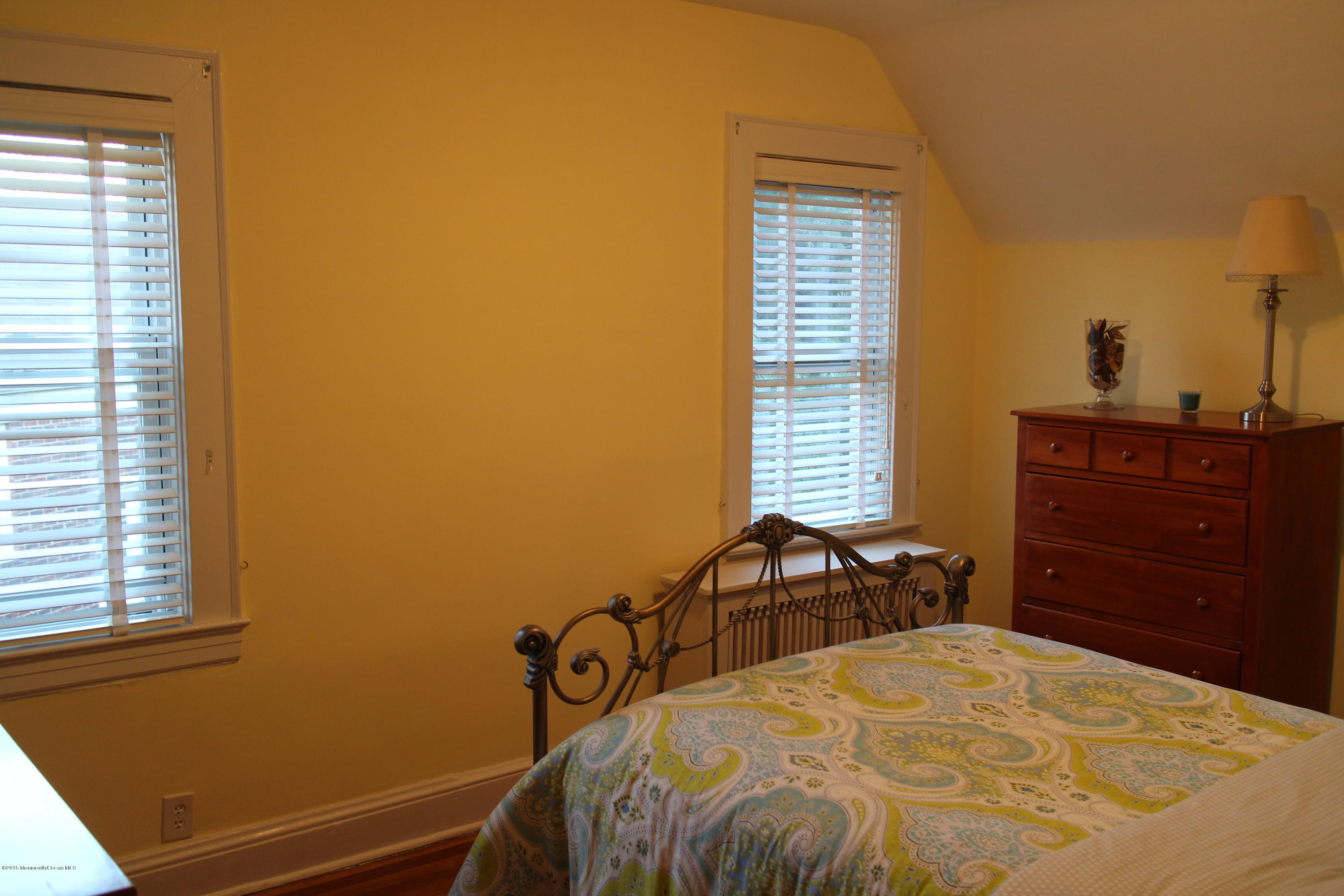 66 Pinckney Road Red Bank, NJ 07701 - Photo 24 of 30 a bedroom with a bed and a dresser