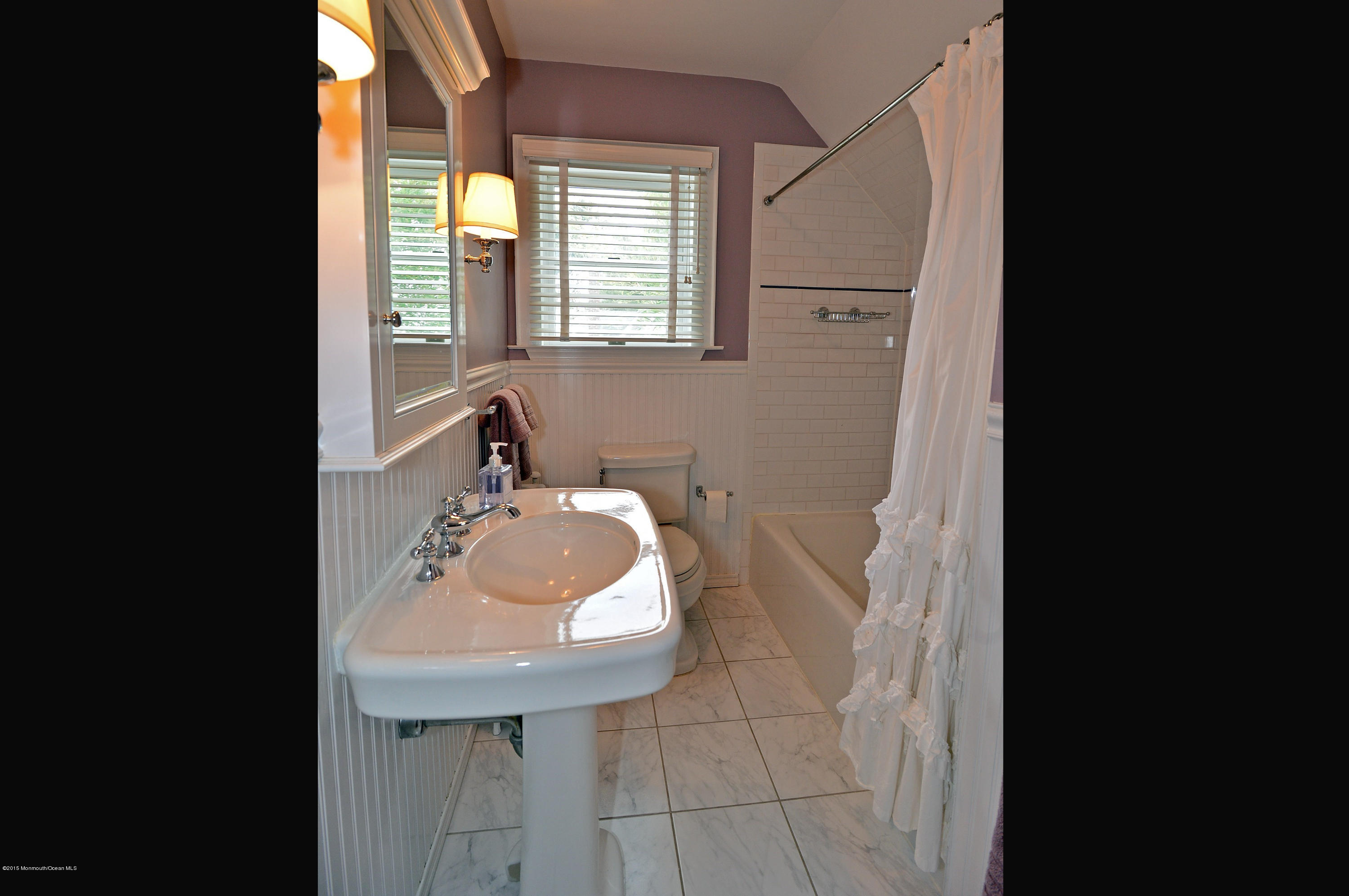 66 Pinckney Road Red Bank, NJ 07701 - Photo 25 of 30 a bathroom with a sink and a mirror