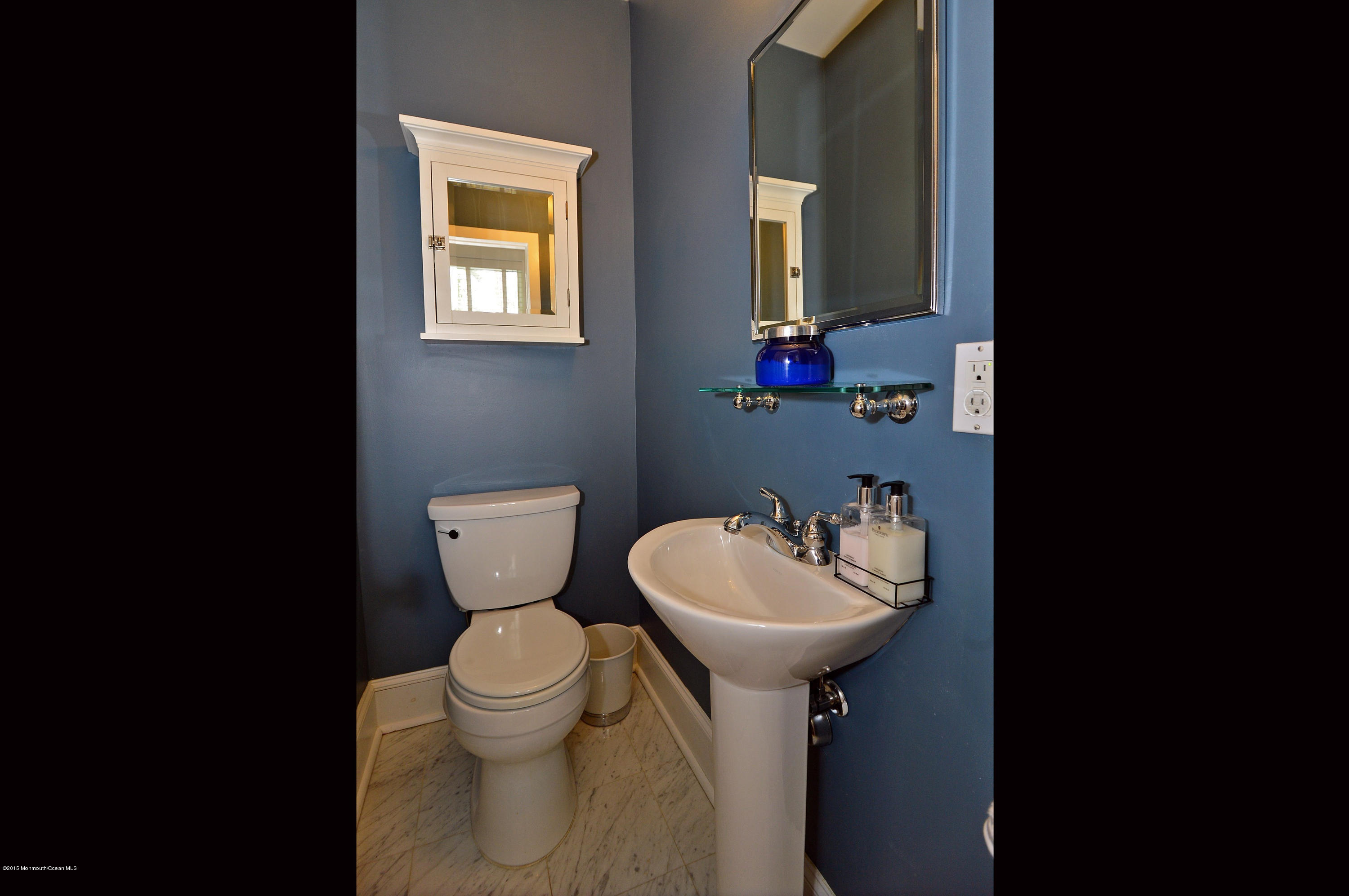66 Pinckney Road Red Bank, NJ 07701 - Photo 26 of 30 a bathroom with a toilet sink and mirror