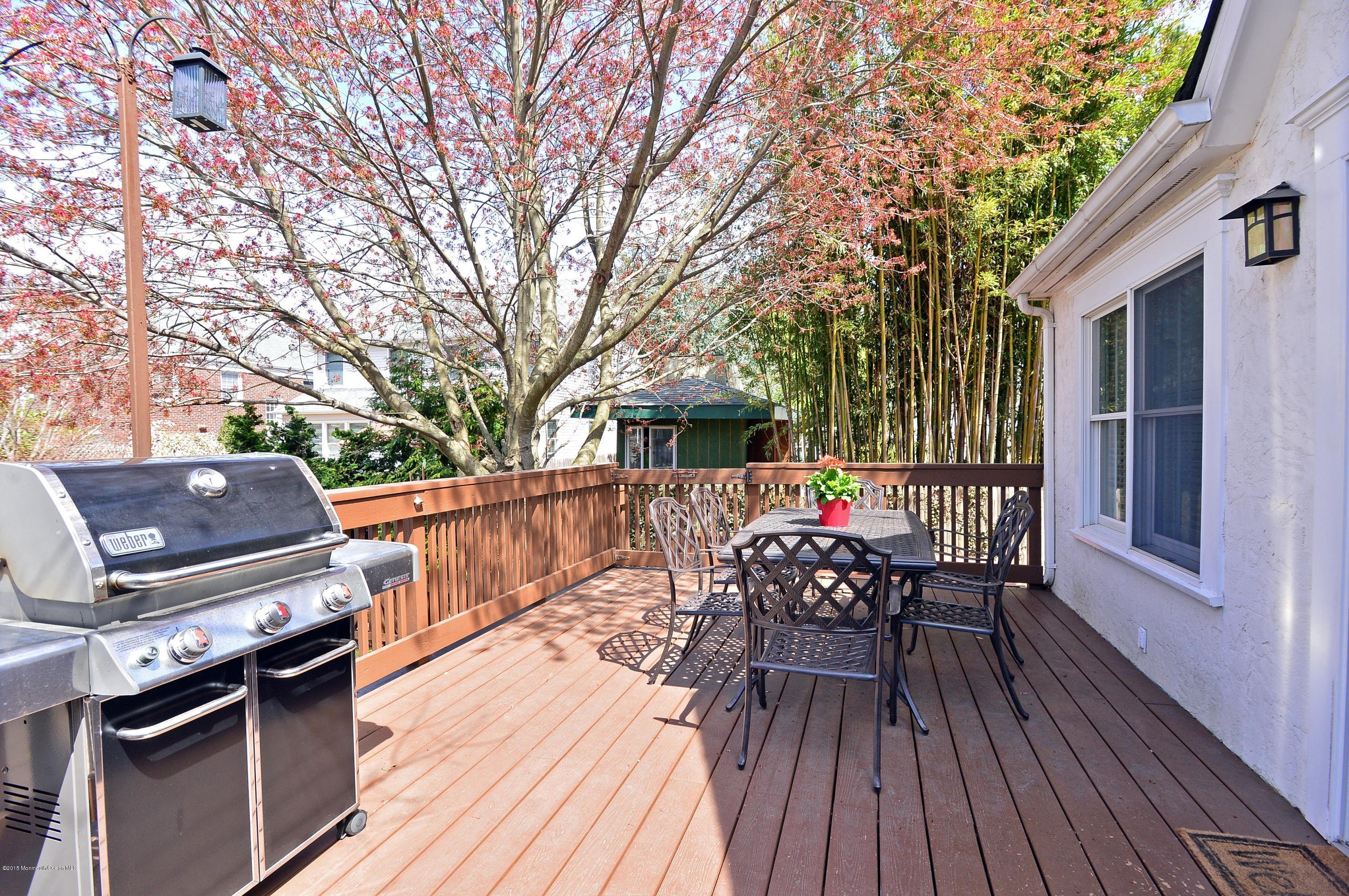 66 Pinckney Road Red Bank, NJ 07701 - Photo 29 of 30 a view of a chairs and table on the wooden deck
