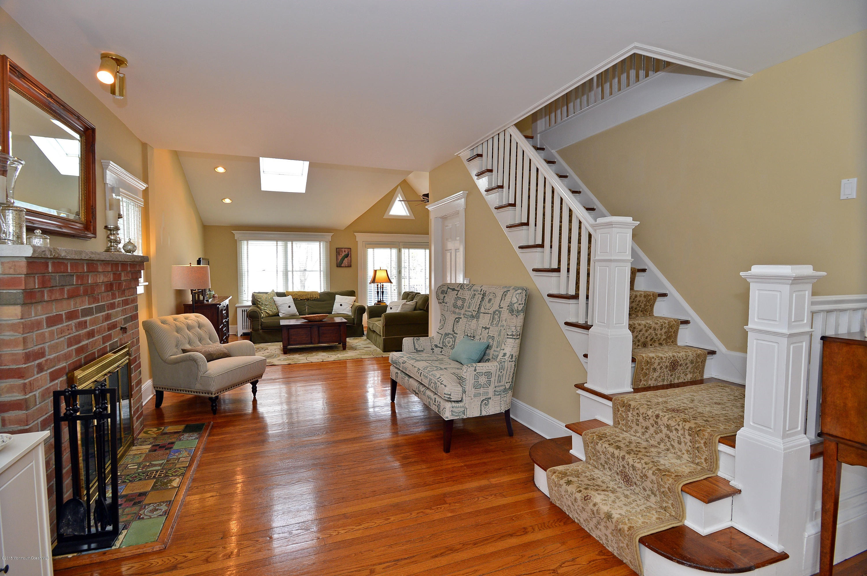 66 Pinckney Road Red Bank, NJ 07701 - Photo 10 of 30 a living room with fireplace furniture and a wooden floor