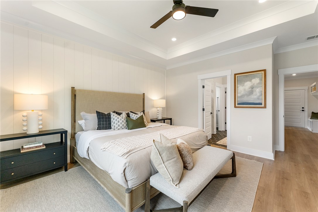 506 Tilman Court Anderson, SC 29621 - Photo 11 of 20 This spacious primary bedroom features a tranquil atmosphere with warm finishes and thoughtful details.