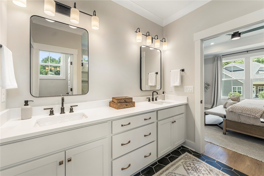 506 Tilman Court Anderson, SC 29621 - Photo 13 of 20 This primary bathroom features a dual vanity, providing ample space for personal routines.