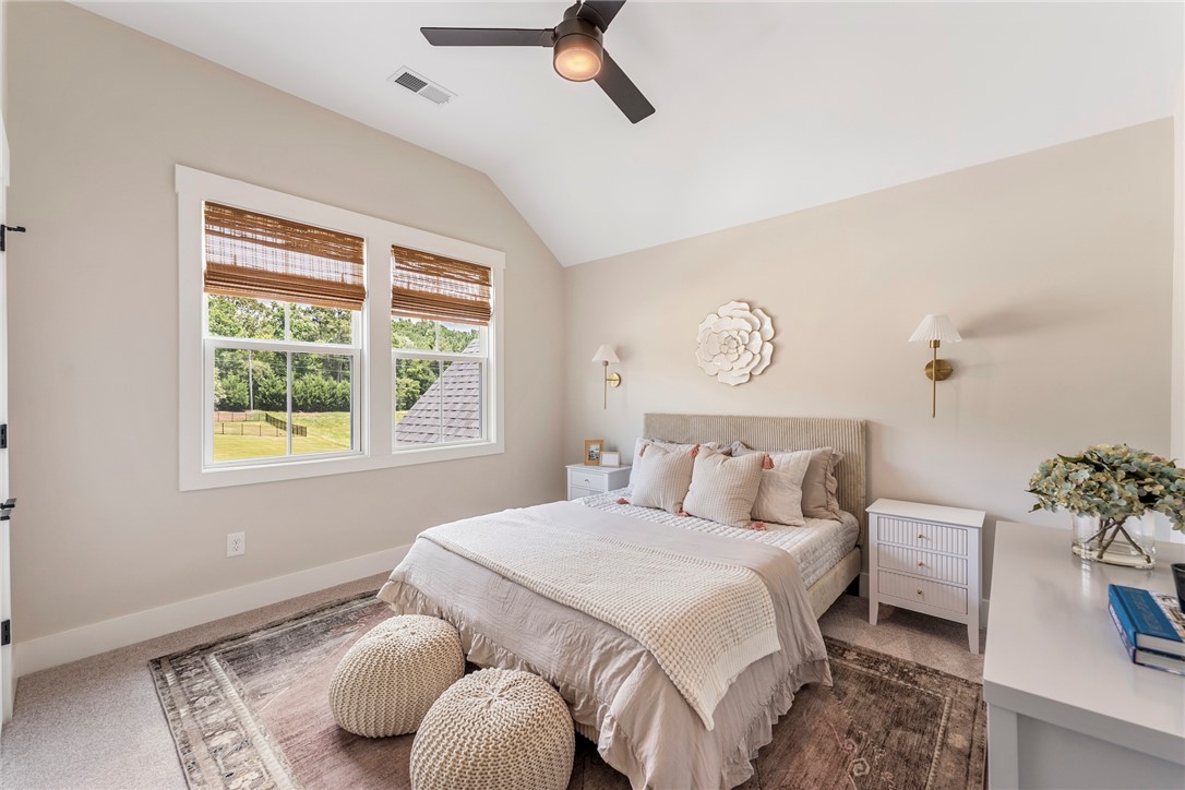 506 Tilman Court Anderson, SC 29621 - Photo 16 of 20 This airy bedroom features high ceilings and ample natural light, offering a tranquil retreat.