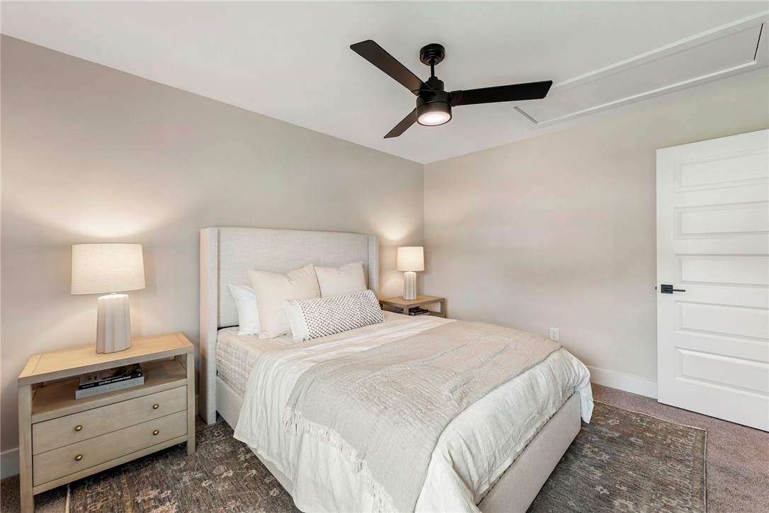 506 Tilman Court Anderson, SC 29621 - Photo 18 of 20 This tranquil bedroom offers a serene retreat with tasteful details and soft, ambient lighting.