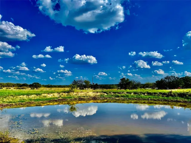 a view of a lake with sunset