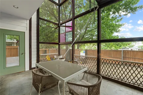 a table that has a table and chairs in it