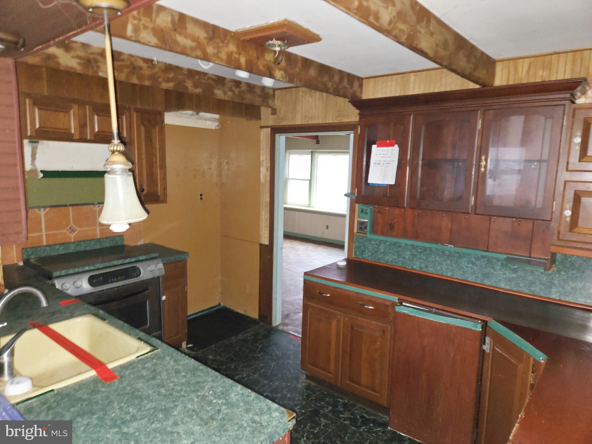 1001 Wayne Road Haddonfield, NJ 08033 - Photo 11 of 34 a room with wooden cabinets and a table