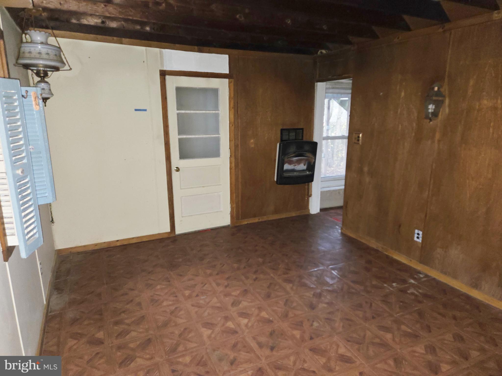 1001 Wayne Road Haddonfield, NJ 08033 - Photo 16 of 34 a view of a hallway with wooden floor and a bathroom