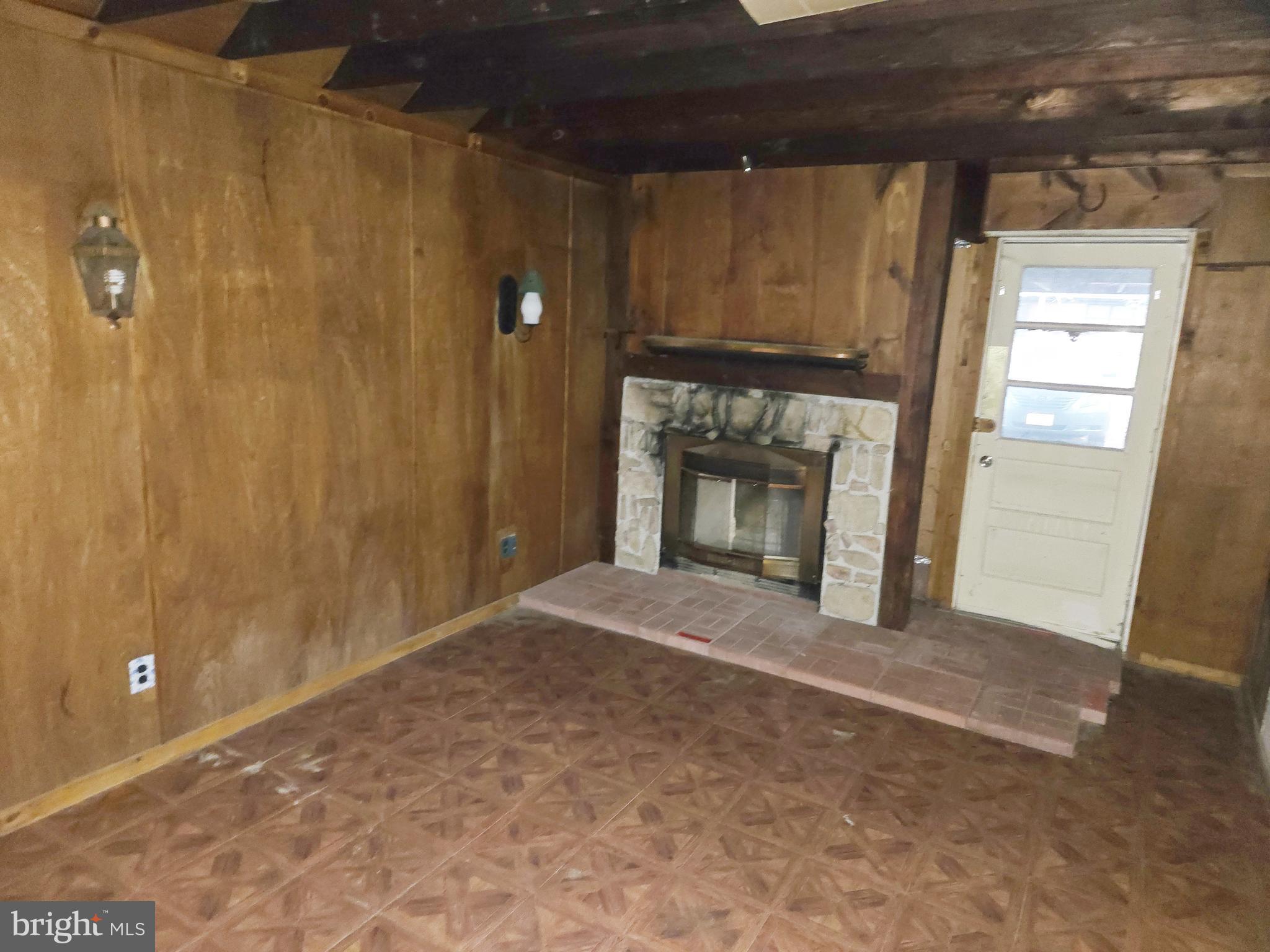 1001 Wayne Road Haddonfield, NJ 08033 - Photo 17 of 34 a view of an empty room with a fireplace and a window