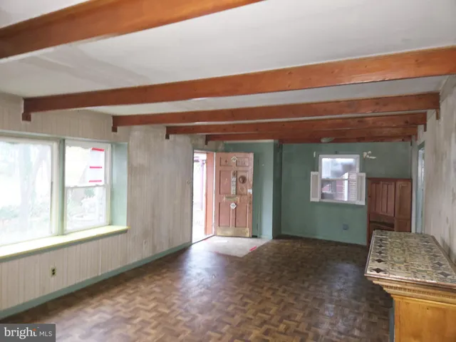 a view of livingroom with fireplace and window