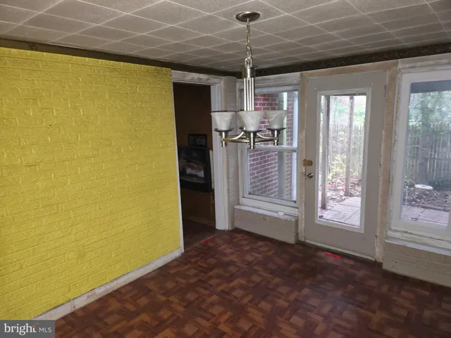 a view of a livingroom with a furniture window and hardwood floor