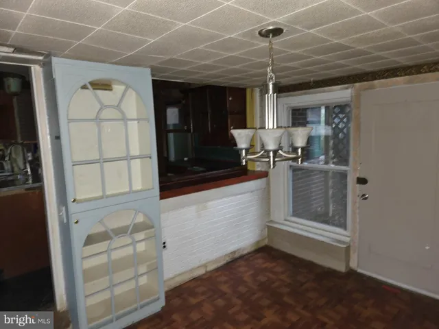 a room with wooden cabinets and a table